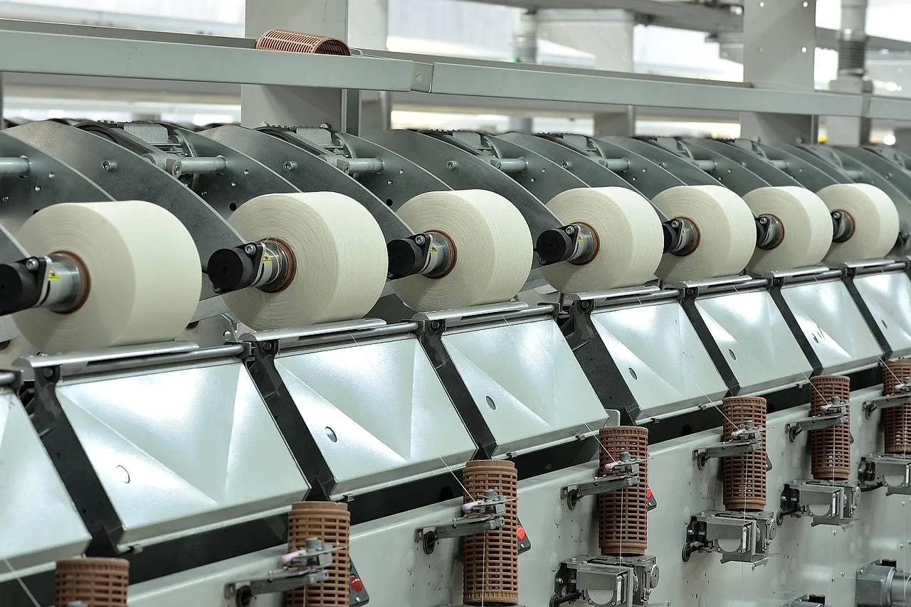 Rows of thread spools on a textile machine